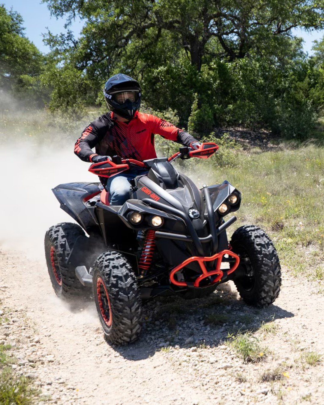 Fort Kent Powersports Man Riding ATV on Dirt road